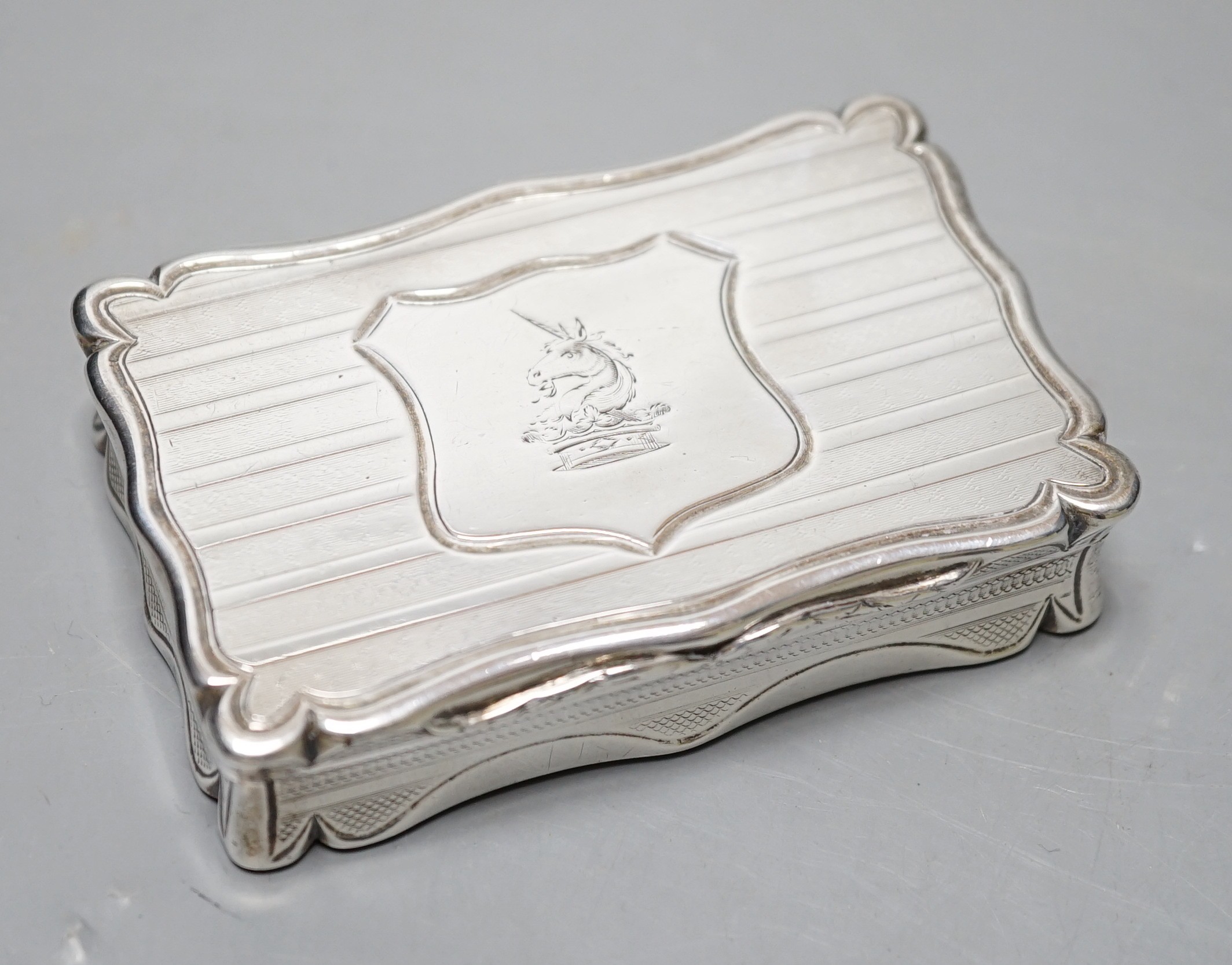 A Victorian engine turned silver shaped rectangular snuff box, Edward Smith, Birmingham, 1847, 80mm, with interior engraved inscription.